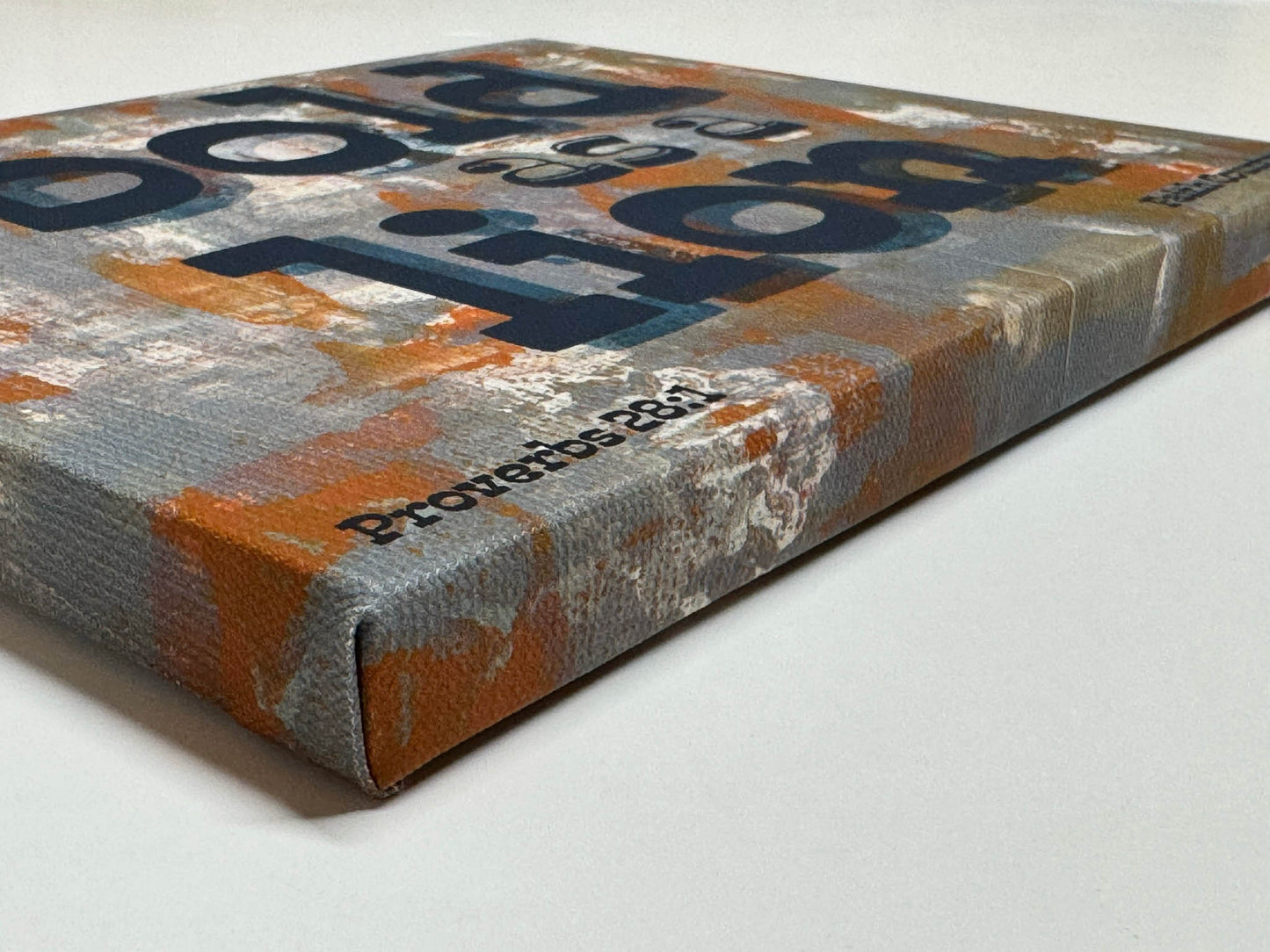 Close-up angled view of 'Bold as a Lion' canvas print showing texture and printed edges