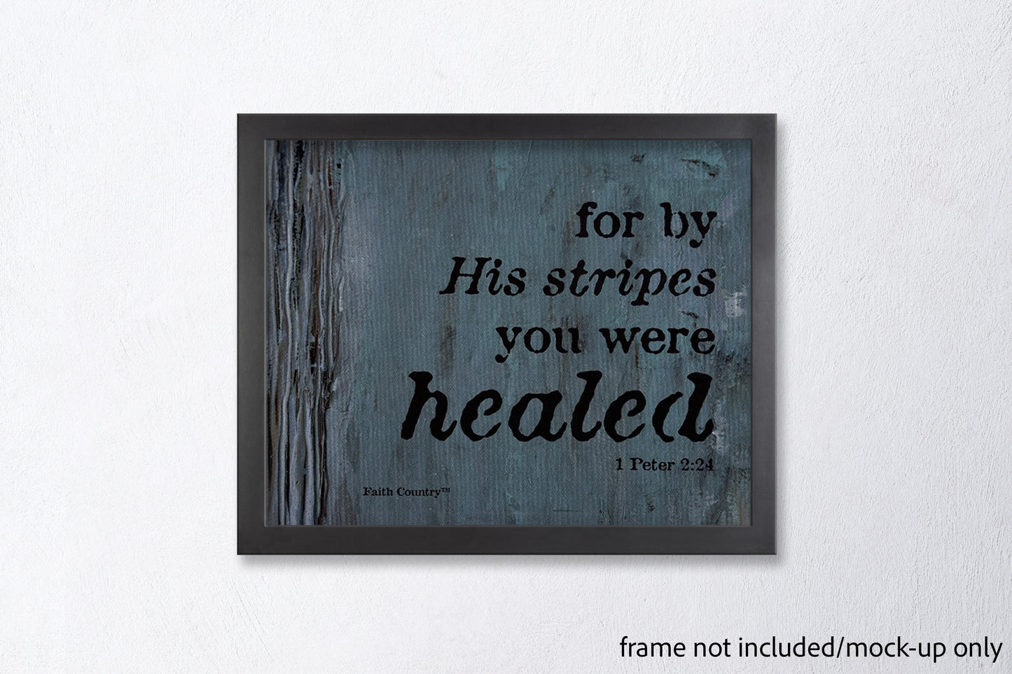 Mockup of 'For by His stripes you were healed - 1 Peter 2:24' scripture wall art in a sleek black frame against a clean white wall. Frame not included.