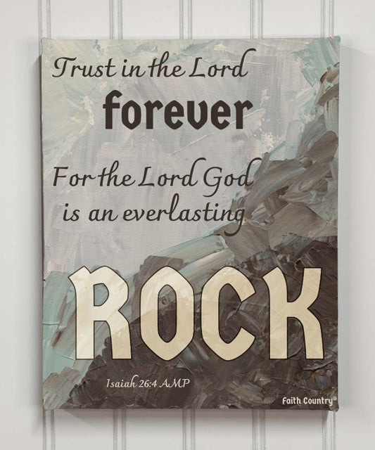 Canvas print reading “Trust in the Lord forever” on abstract painted background, hung on white wall