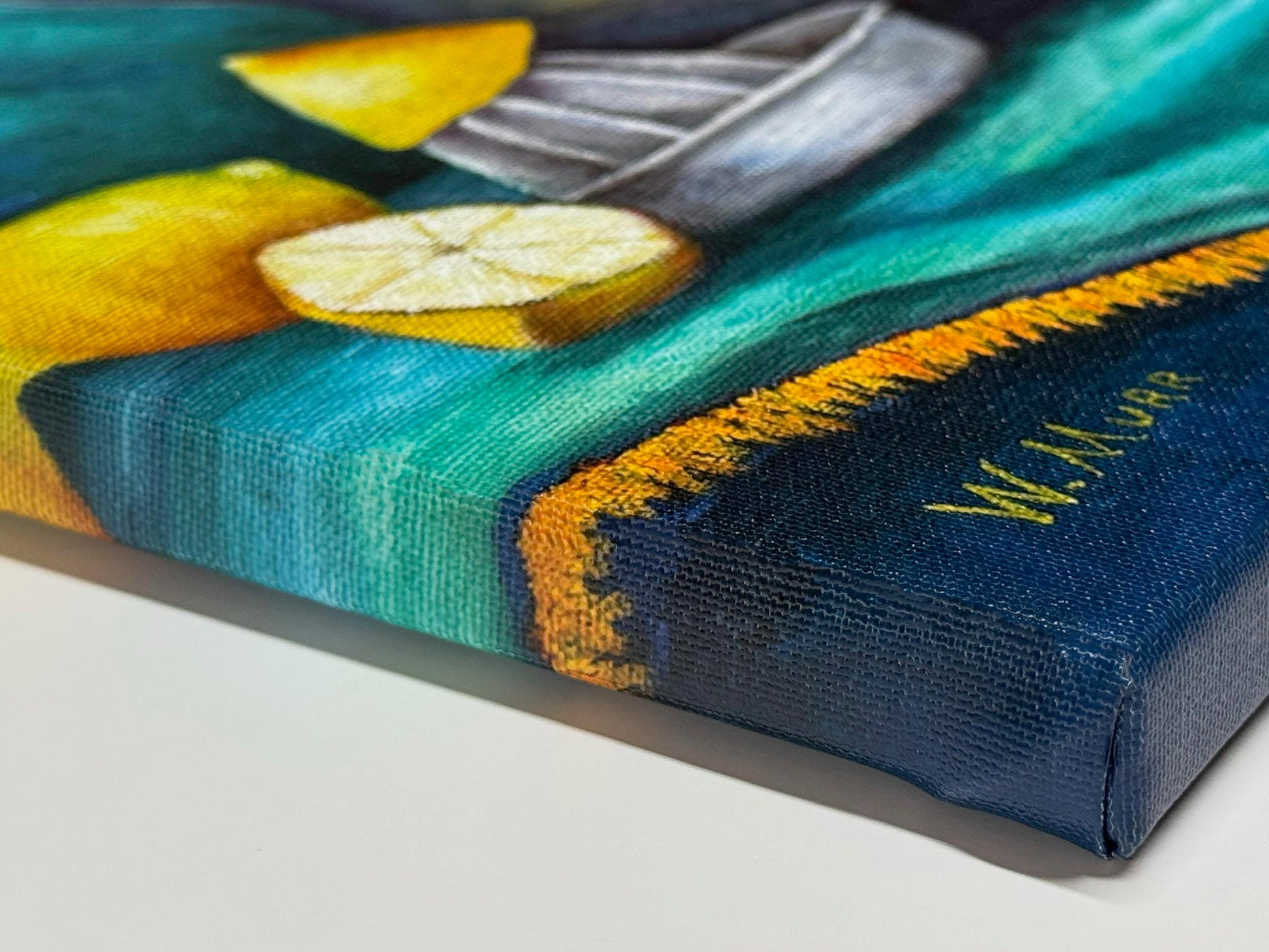 Close-up of wrapped canvas edge showing texture and brush detail of the lemons and cloth in Lemonade still life artwork.